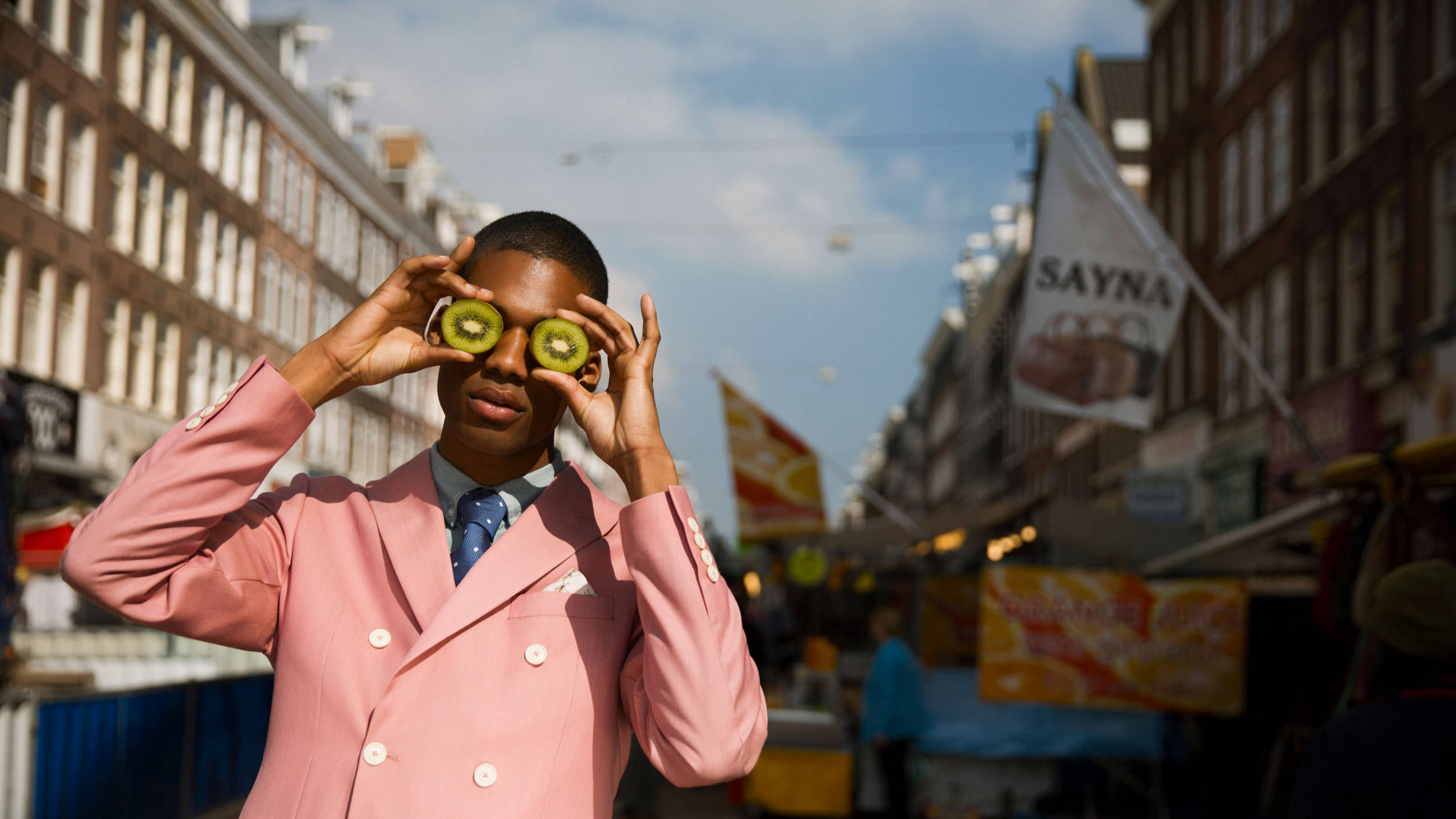 Sir Hotels - model in pink suit