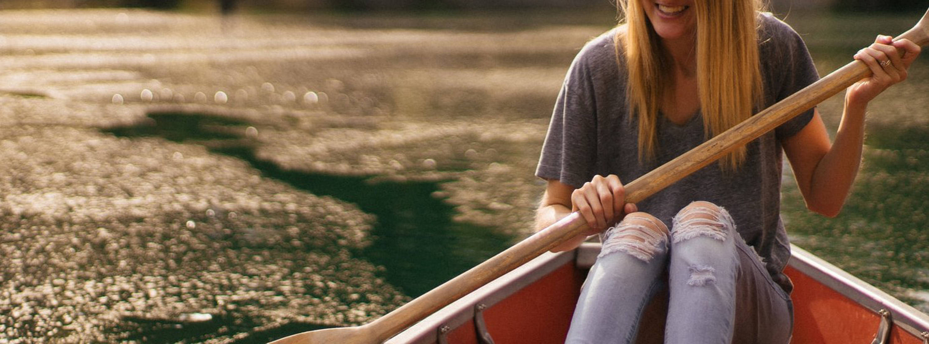 Incorrectly cropped image of girl in canoe, part of face cropped off [original by jordanbauer]